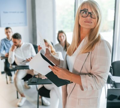 Conception of education and master class. Group of professional business people is in the office